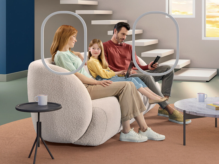 Image showing a family sitting on a sofa, the rest of the living room is created in 3D and composited afterwards